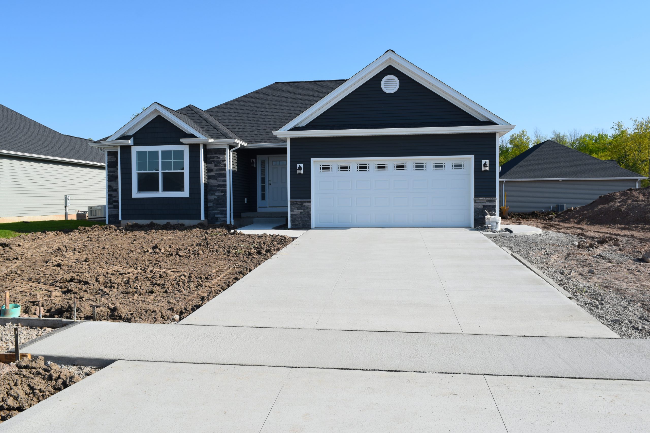 New Concrete Lane and sidewalk in front of a newly constructed home.
